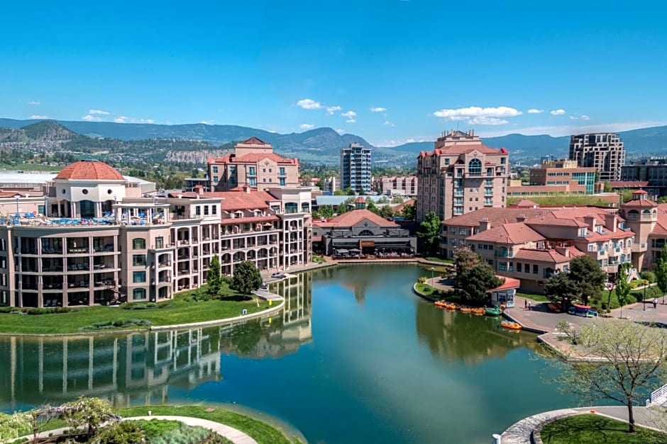 The Delta Hotels Grand Okanagan Resort. Beautiful blue waters with the hotel spread behind it.