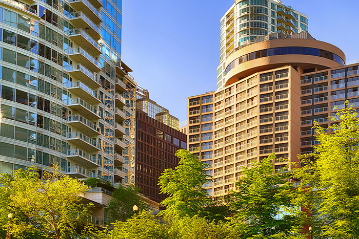 The Delta Hotels Grand Okanagan Resort. Beautiful blue waters with the hotel spread behind it.
